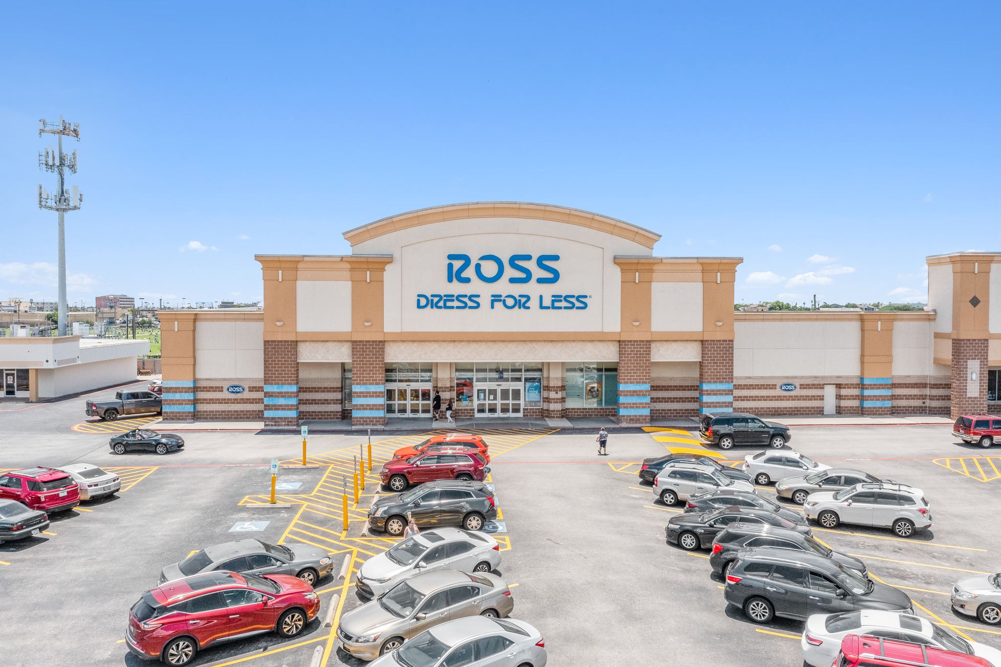 The Ross Dress for Less anchor storefront at The Plaza on Galveston Island, its arched entry rising over a busy parking field