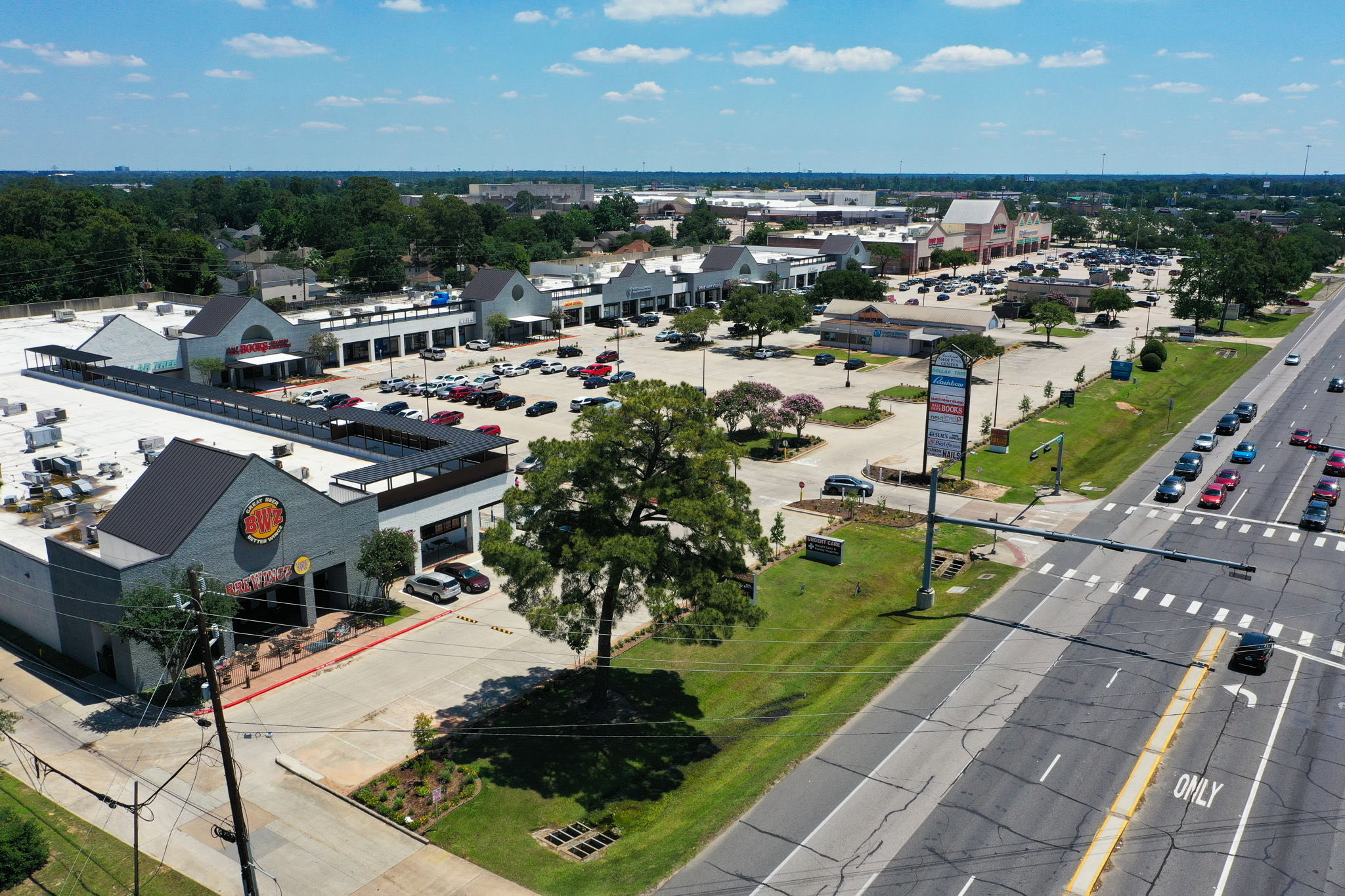 Aerial view of Deerbrook Shopping Center along FM 1960 in Humble